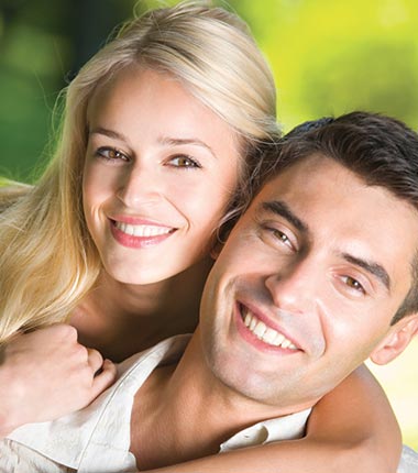Couple smiling and holding each other