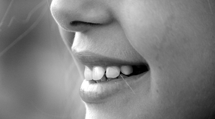 up close child's smile crooked teeth