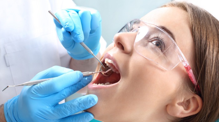 girl getting a root canal procedure