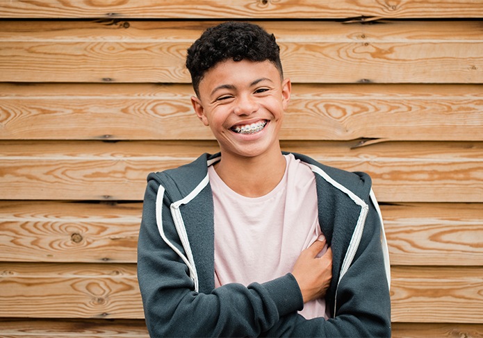 boy with braces smiling