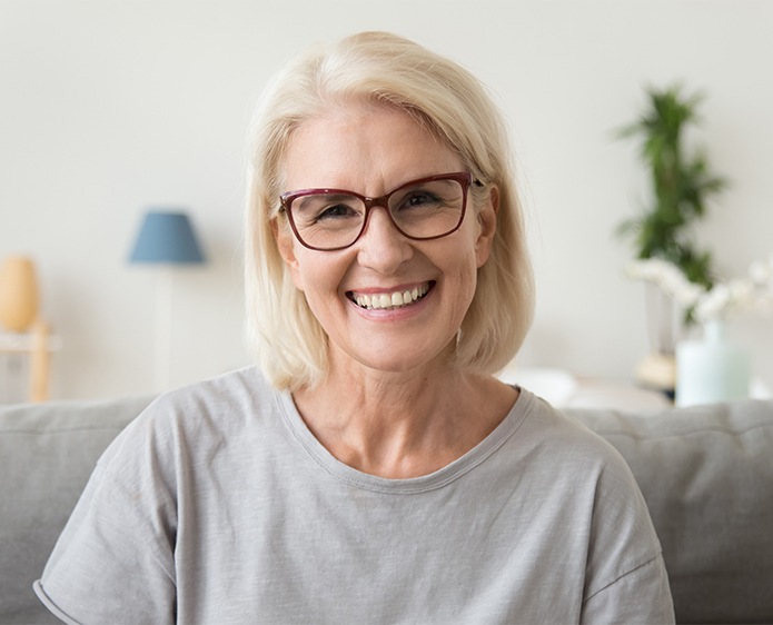 older lady smiling with glasses