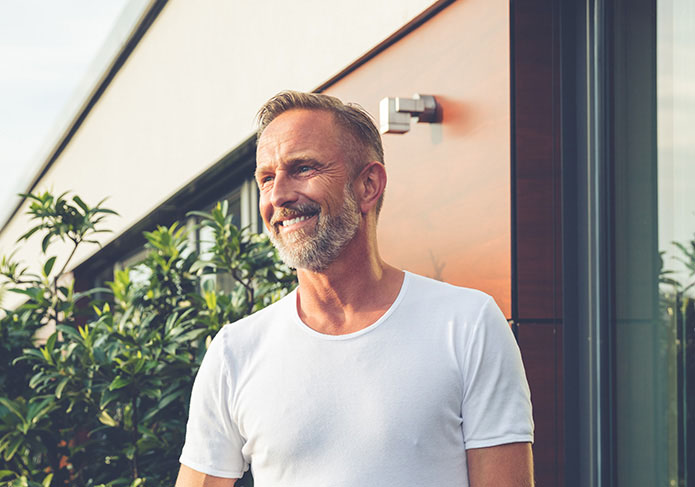 Smiling man in backyard